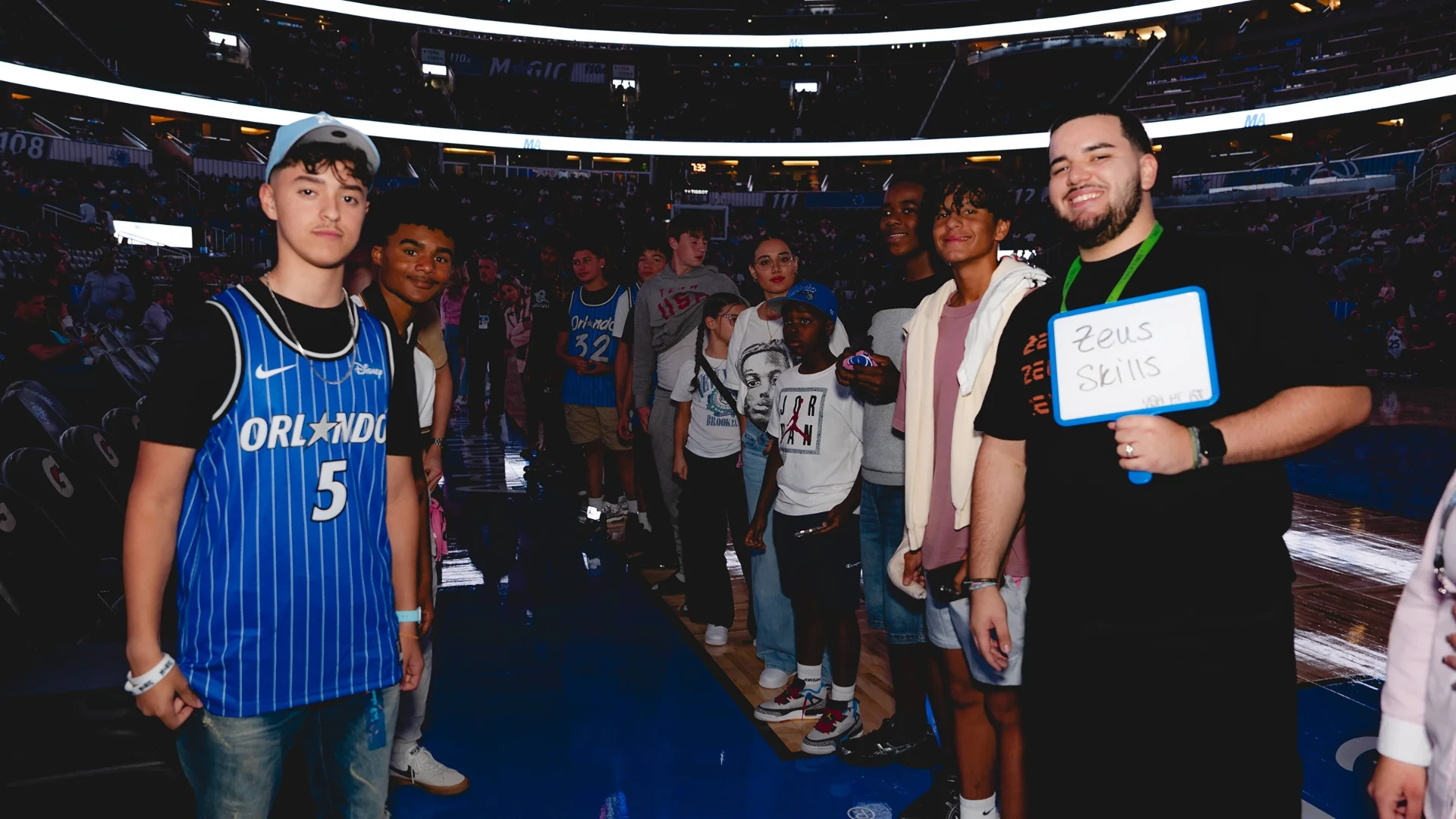 Zeus Skills group on the court at an Orlando Magic game