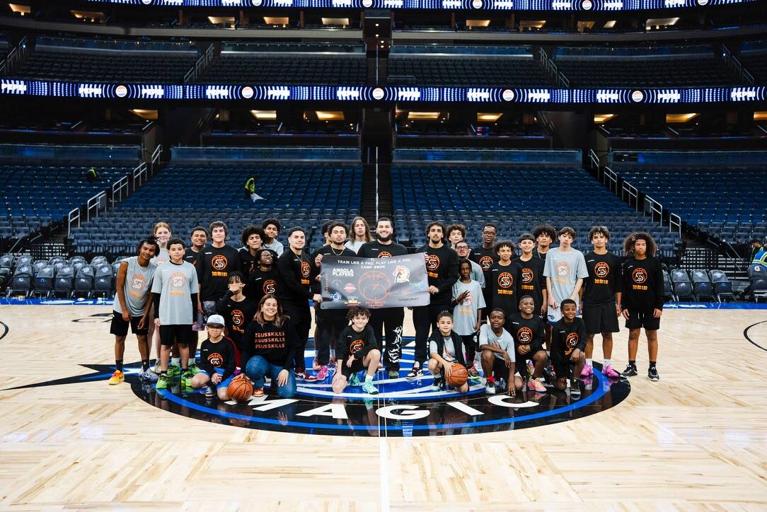 Zeus Skills camp group photo at center court of an NBA arena