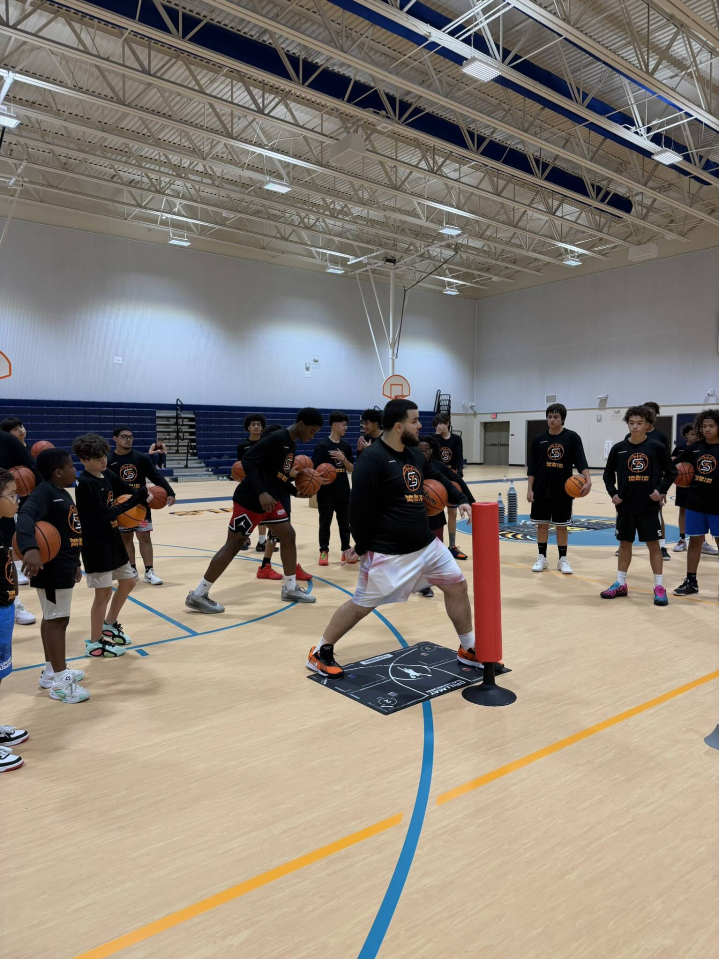 Players lined up for a closeout drill during a Zeus Skills camp