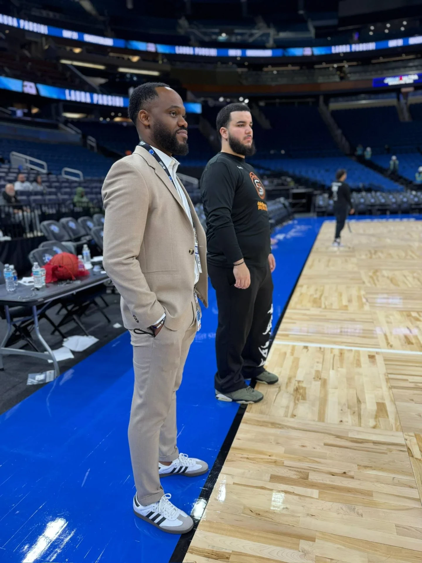 Zeus Skills coaches standing courtside inside an NBA arena