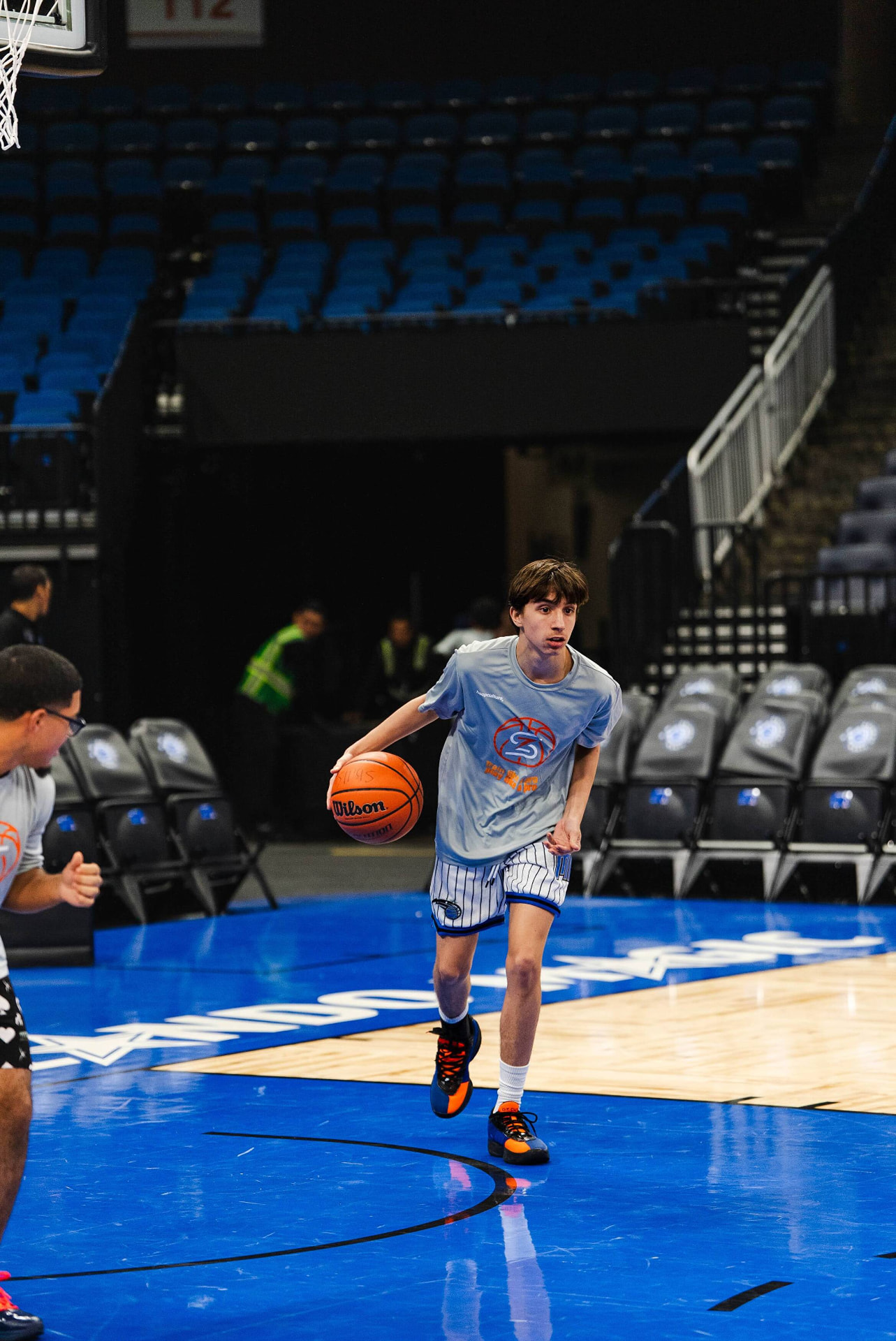 Player pushing the ball in transition on an NBA court