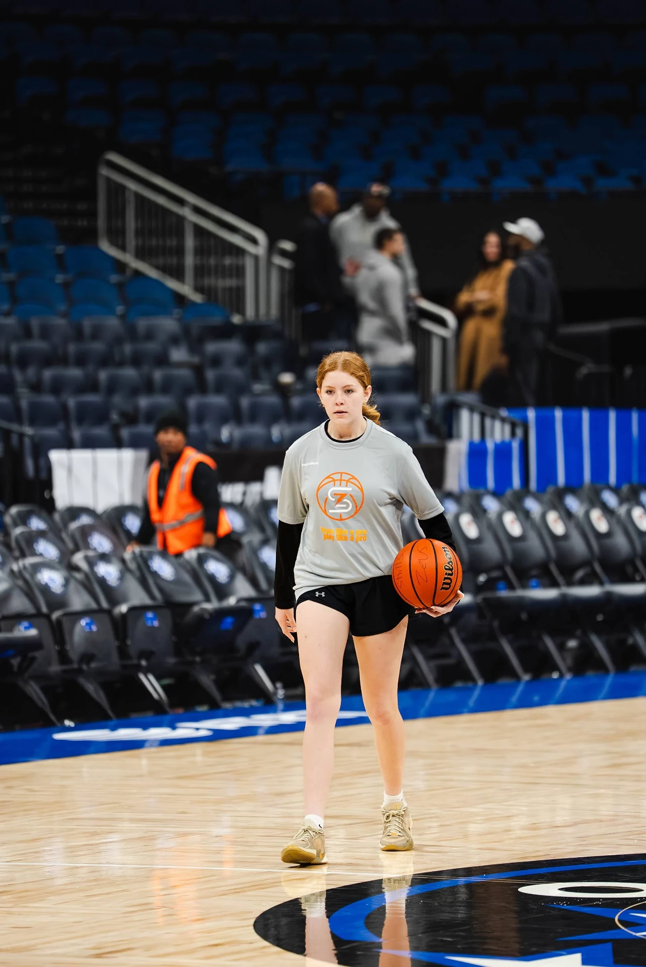 Young player dribbling on an NBA floor during a Zeus Skills experience